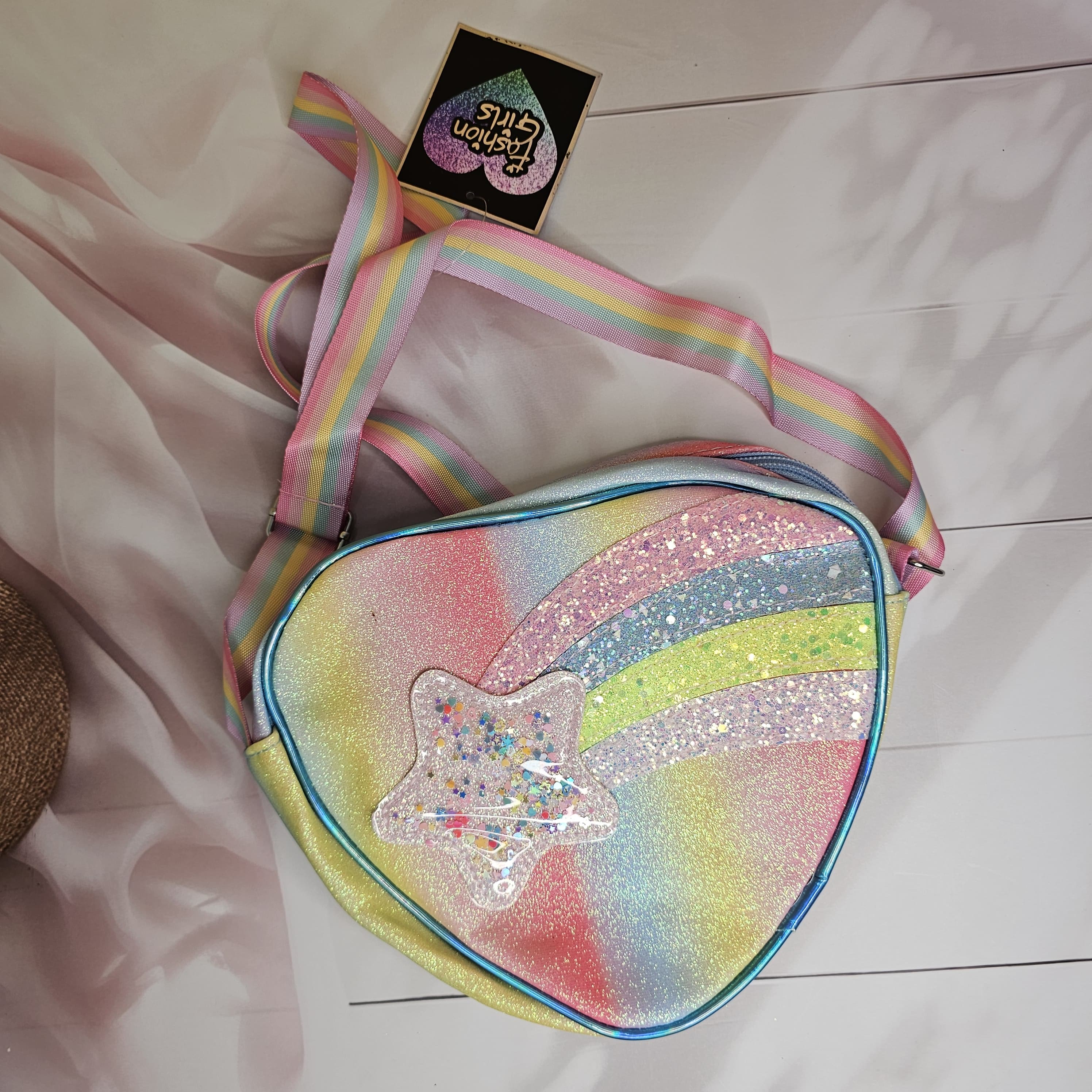 Sparkly rainbow glitter heart-shaped mini bag for girls, a cute crossbody purse for carrying small essentials in www.usmile.toys
