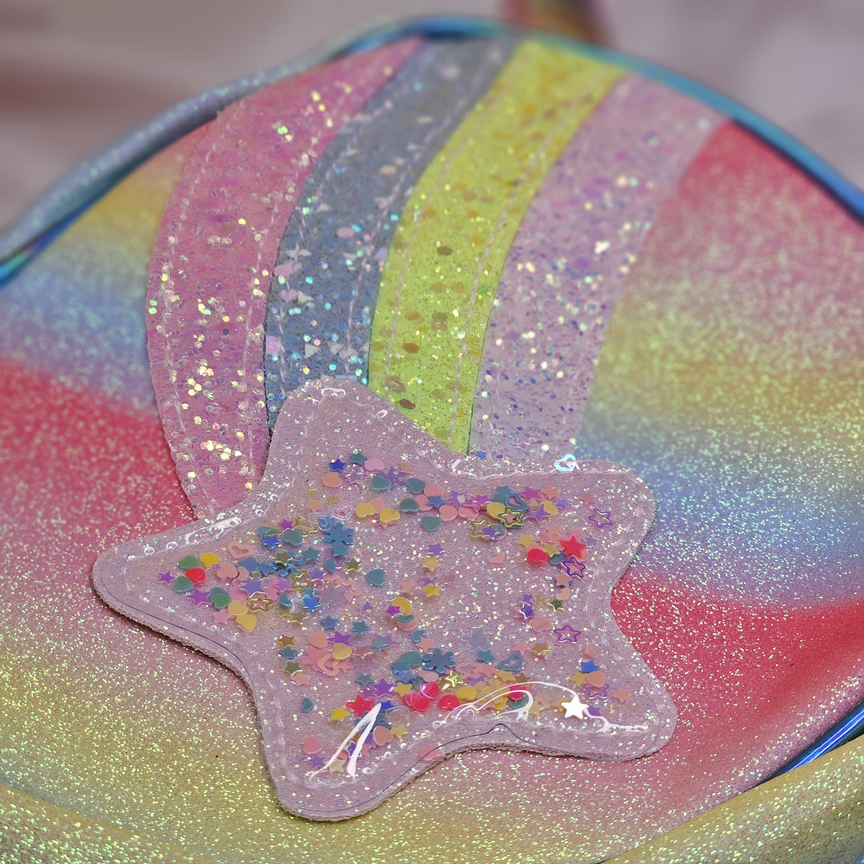 Shimmering heart-shaped mini bag with rainbow stripes and glitter detail, a stylish sling purse for little girls in www.usmile.toys
