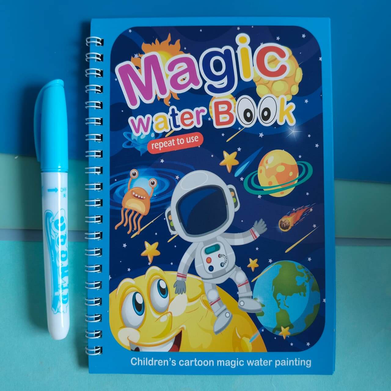 Children's magic water book with an astronaut design on a blue background