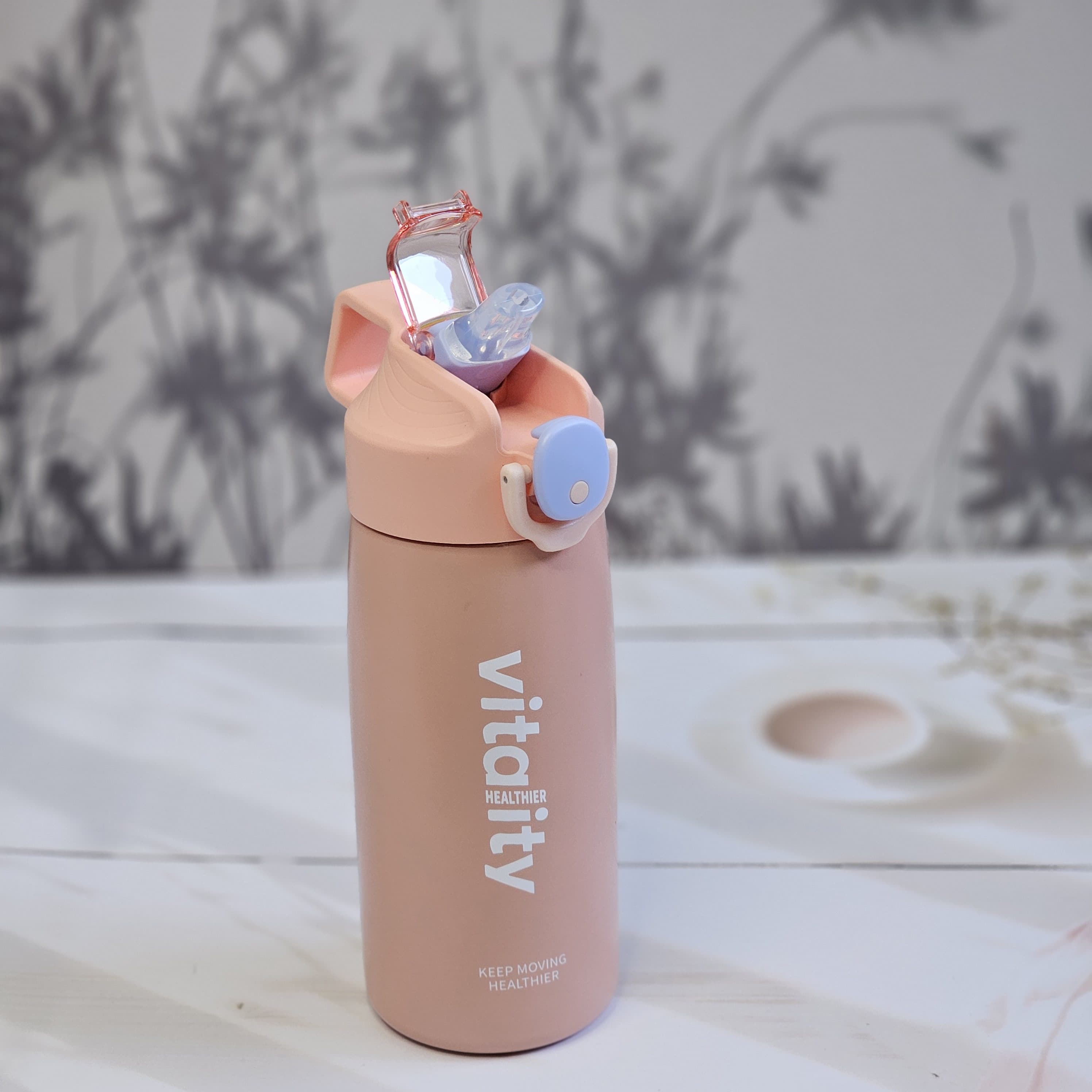 Stainless steel water bottles for kids and adults, featuring double-walled insulation, flip-top lids, and 'keep moving healthier' www.usmile.toys