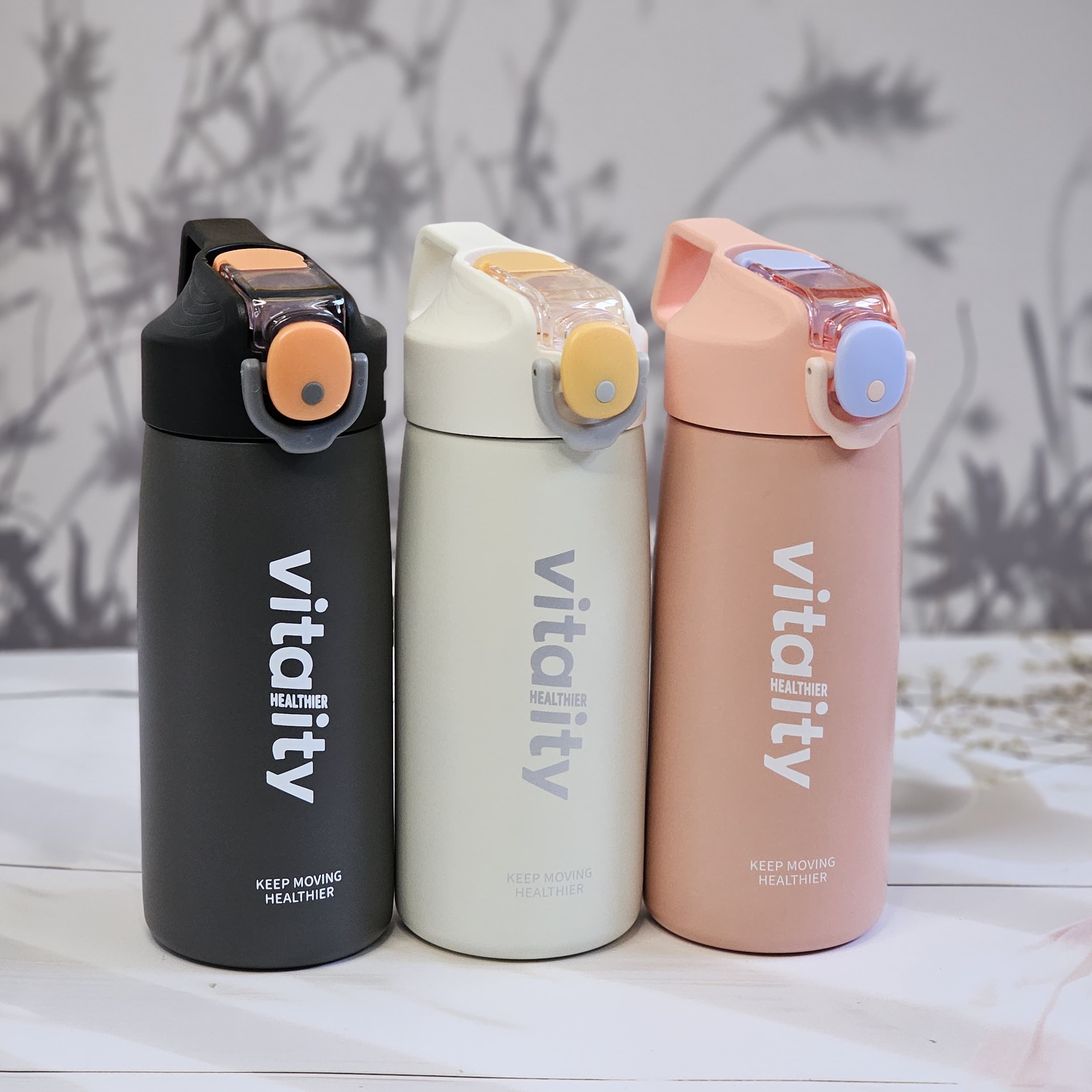 Stainless steel water bottles for kids and adults, featuring double-walled insulation, flip-top lids, and 'keep moving healthier www.usmile.toys