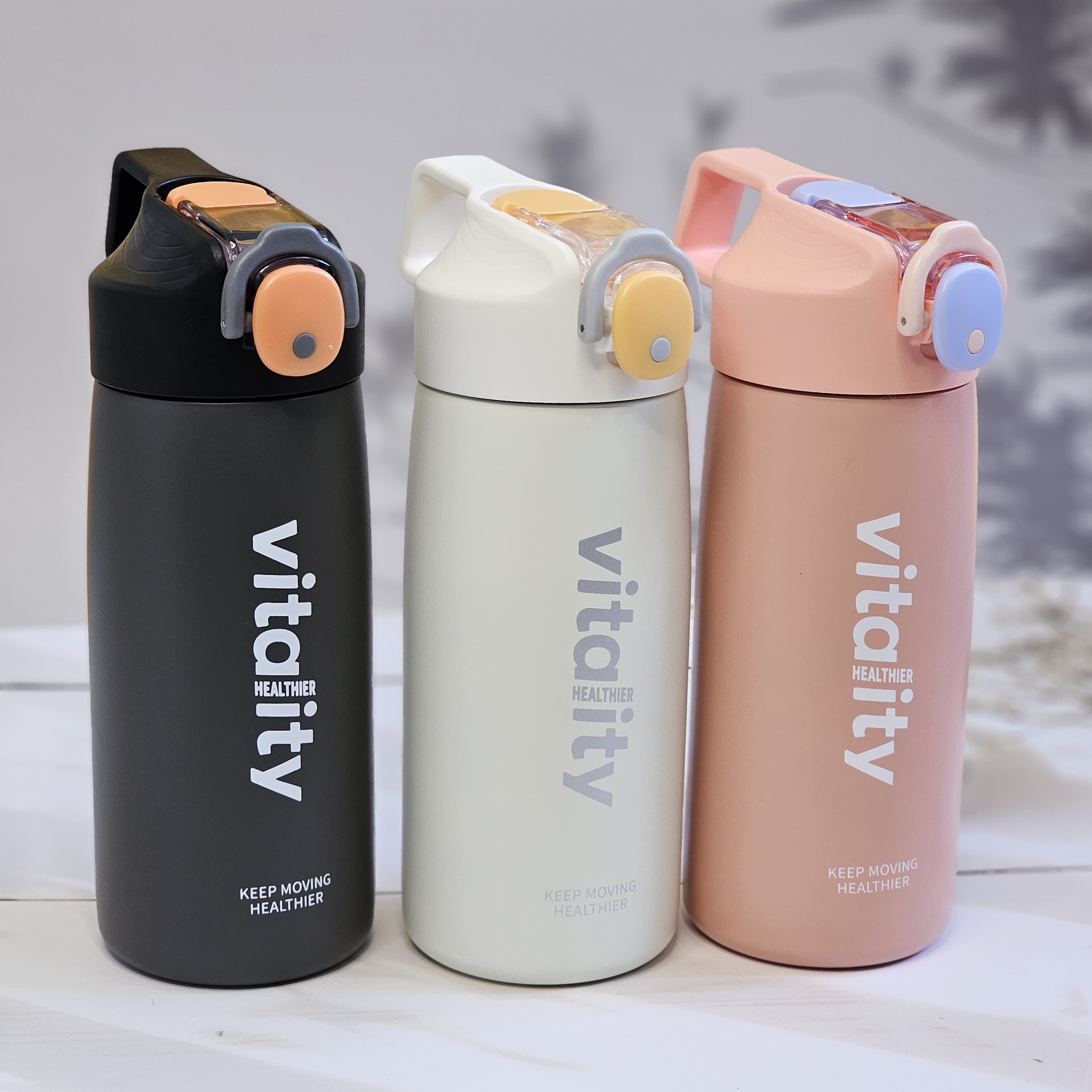Stainless steel water bottles for kids and adults, featuring double-walled insulation, flip-top lids, and 'keep moving healthier' www.usmile.toys