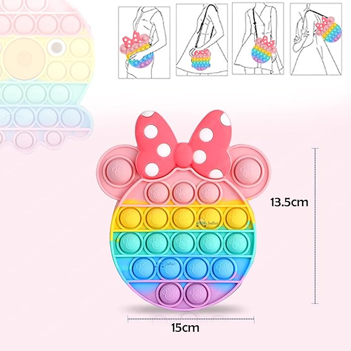 Usmile Toys Kids' rainbow-colored Pop It fidget crossbody bag with a large pink polka-dot bow, shown with fun keychains including a brown bear and a pink unicorn."