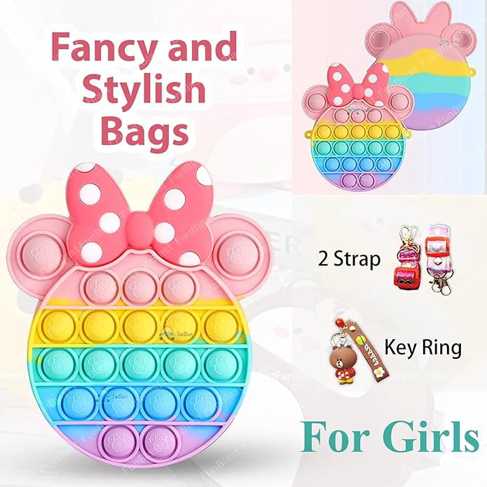 Front view of a Usmile Toys girls' sling bag, designed as a rainbow Pop It fidget toy with a prominent pink Minnie Mouse-style bow and a striped strap." www.usmile.toys