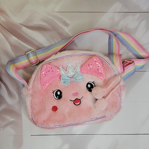 This charming plush bunny purse with sparkly details and a rainbow strap is a delightful sling bag for little girls www.usmile.toys
