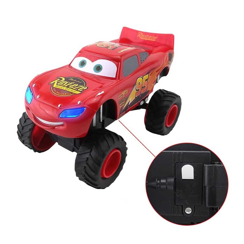 Red toy car with character face and detailed design on a white background