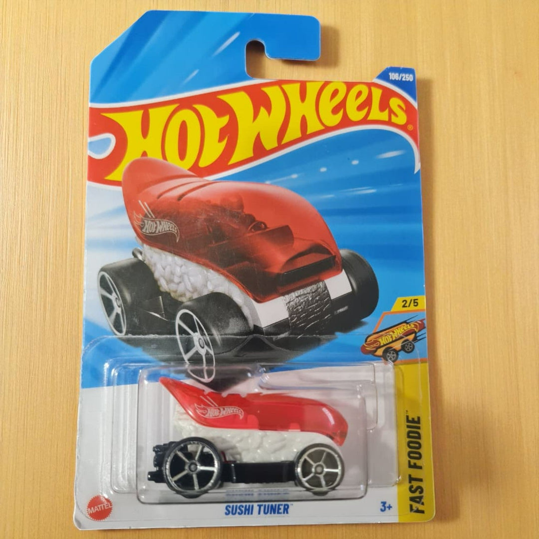 Hot Wheels toy car in packaging on a wooden surface