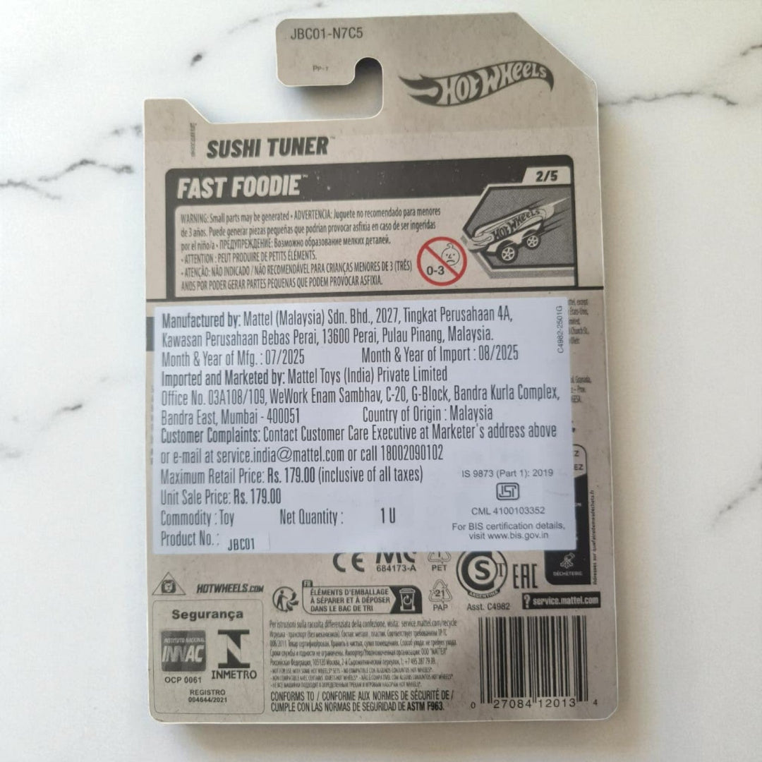 Hot Wheels Sushi Tuner toy packaging on a marble surface