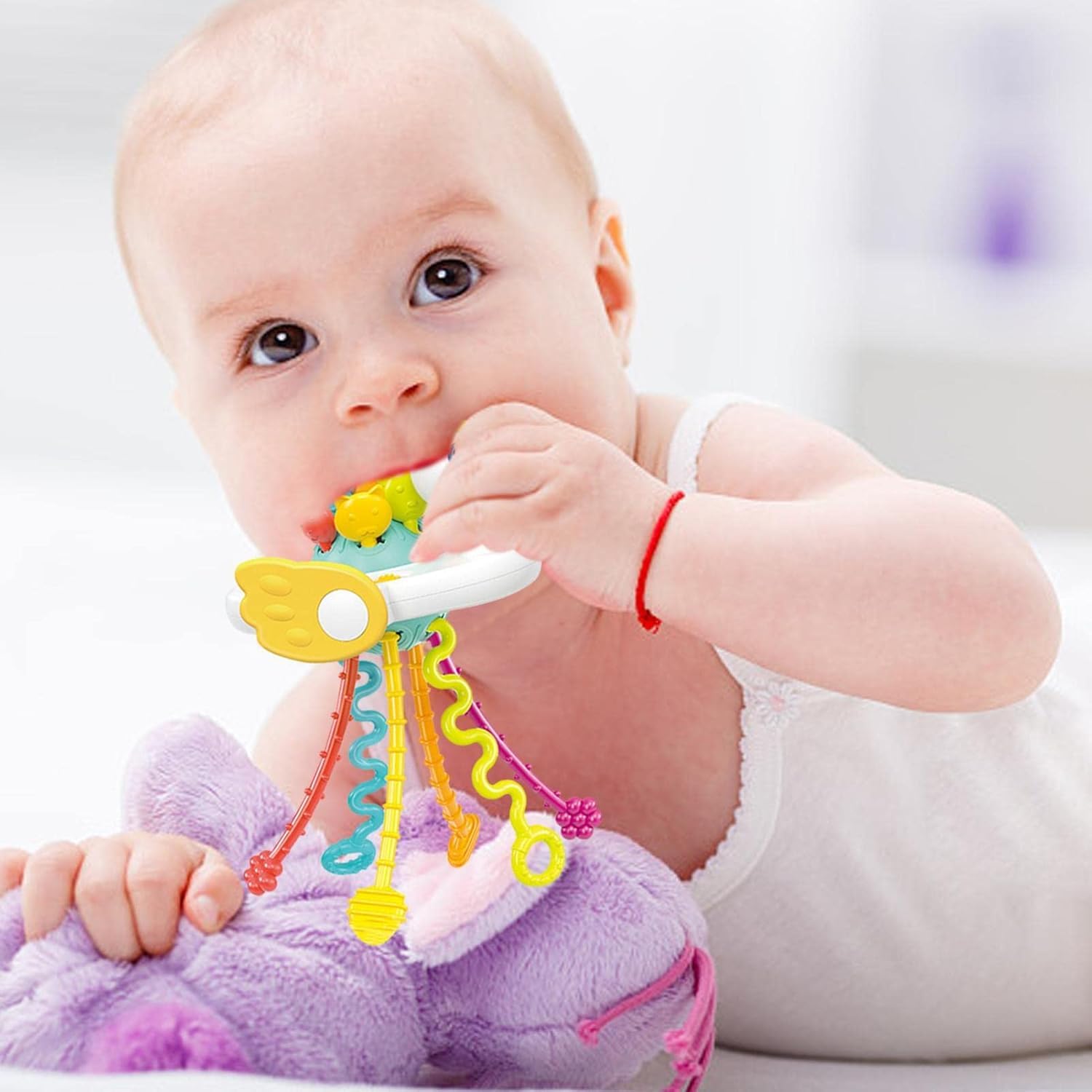 Colorful swan rattle teether sensory toy for babies by Usmile Toys, featuring multiple pull strings and textured elements for engagement." www.usmile.toys