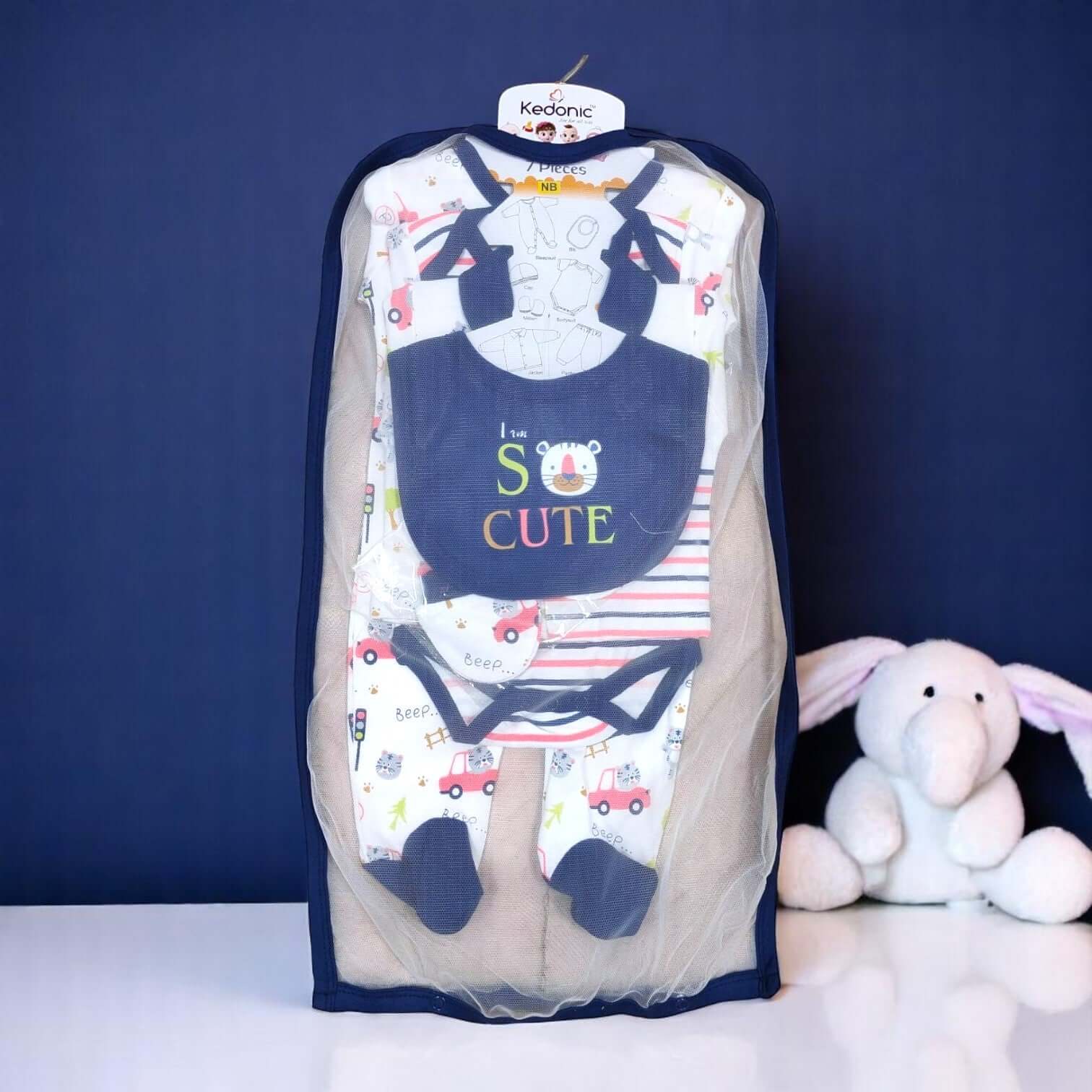 "Full view of a 7-piece newborn baby clothing set, featuring a grey and white dinosaur print, including bodysuits, pants, bib, and cap, available at uSmile.toys.www.usmile.toys