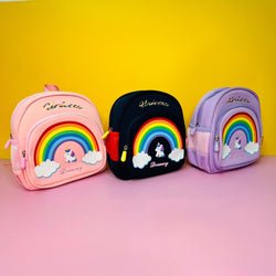Set of three unicorn-themed kids' backpacks with rainbow design – perfect for school and travel."

"Unicorn children bags with safety features – available in pink, navy blue, and purple Usmile.toys