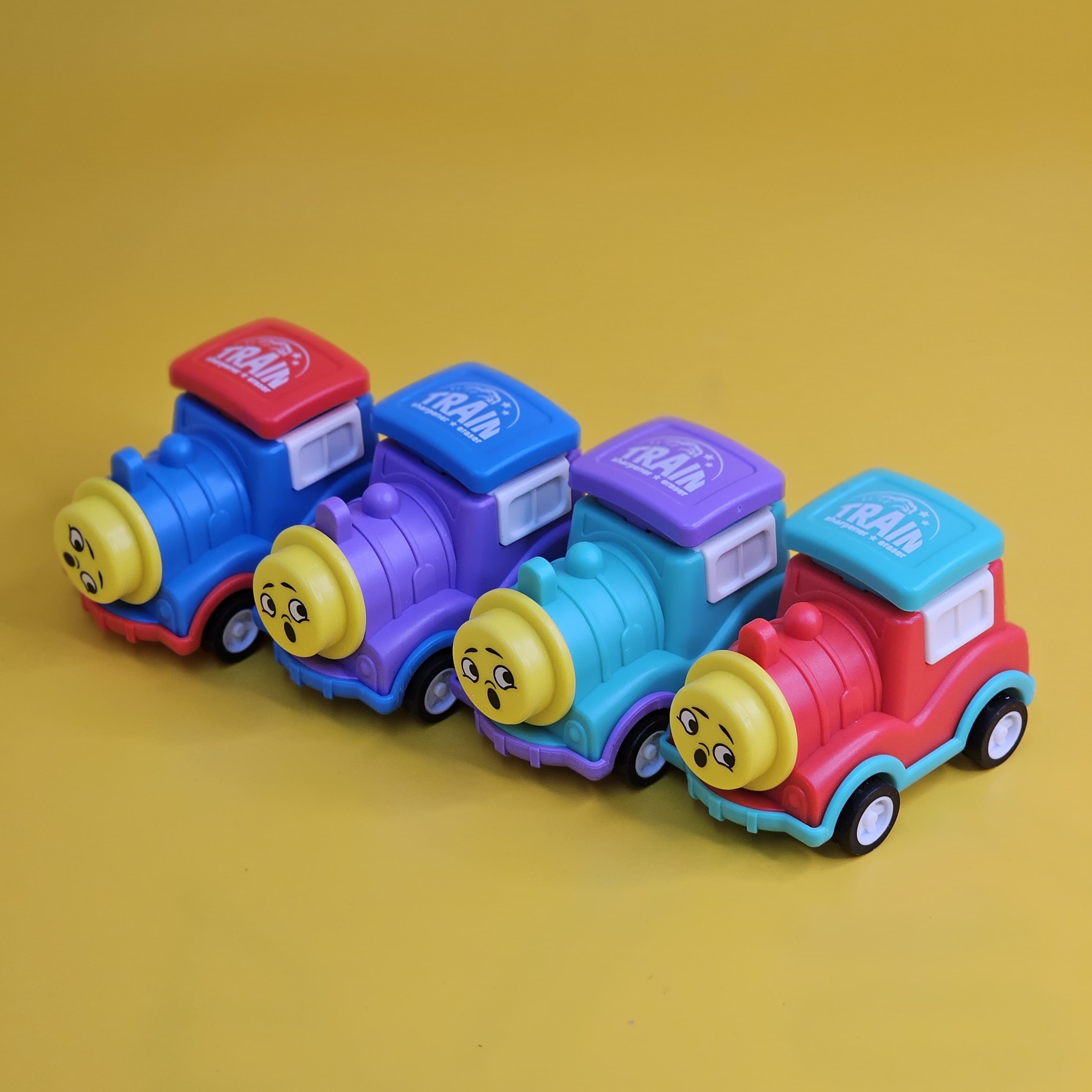 Multicolour pencil sharpener and eraser set designed like adorable train engines, making homework and drawing more enjoyable for kids www.usmile.toys