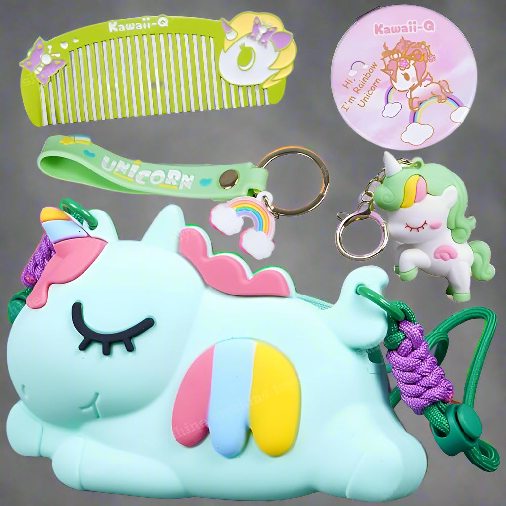 Close-up of a light blue unicorn-shaped silicone cross-body purse with rainbow stripe detail, matching unicorn comb, keychain, and circular mirror. Ideal stylish bag for girls from uSmile.toys." www.usmile,.toys