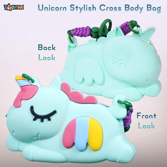 Close-up of a light blue unicorn-shaped silicone cross-body purse with rainbow stripe detail, matching unicorn comb, keychain, and circular mirror. Ideal stylish bag for girls from uSmile.toys." www.usmile,.toys