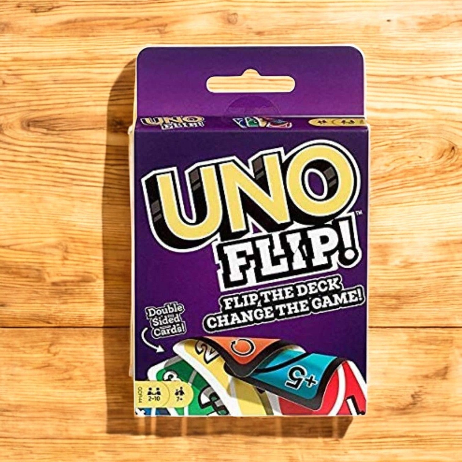 "Purple packaging for UNO Flip card game, featuring the 'Flip the Deck! Change the Game!' tagline and indicating double-sided cards." www.usmile.toys