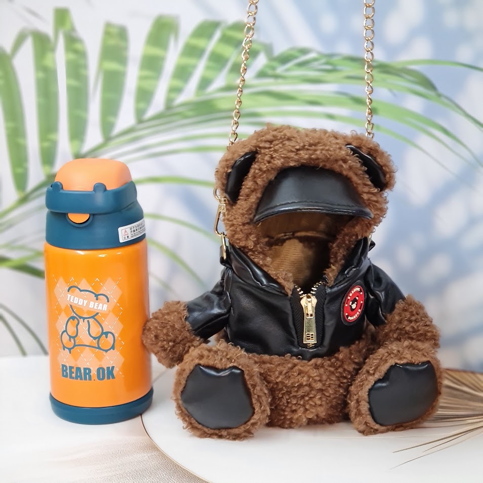 "Usmile Toys cute water bottles for kids, designed with soft teddy bear-themed insulated covers, perfect for keeping drinks hot or cold on the go."
