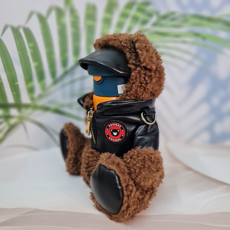 "Close-up of two Usmile Toys SS vacuum water bottles, each nestled inside a unique teddy bear-like protective sleeve, showing the pink and purple bottle tops." www.usmile.toys