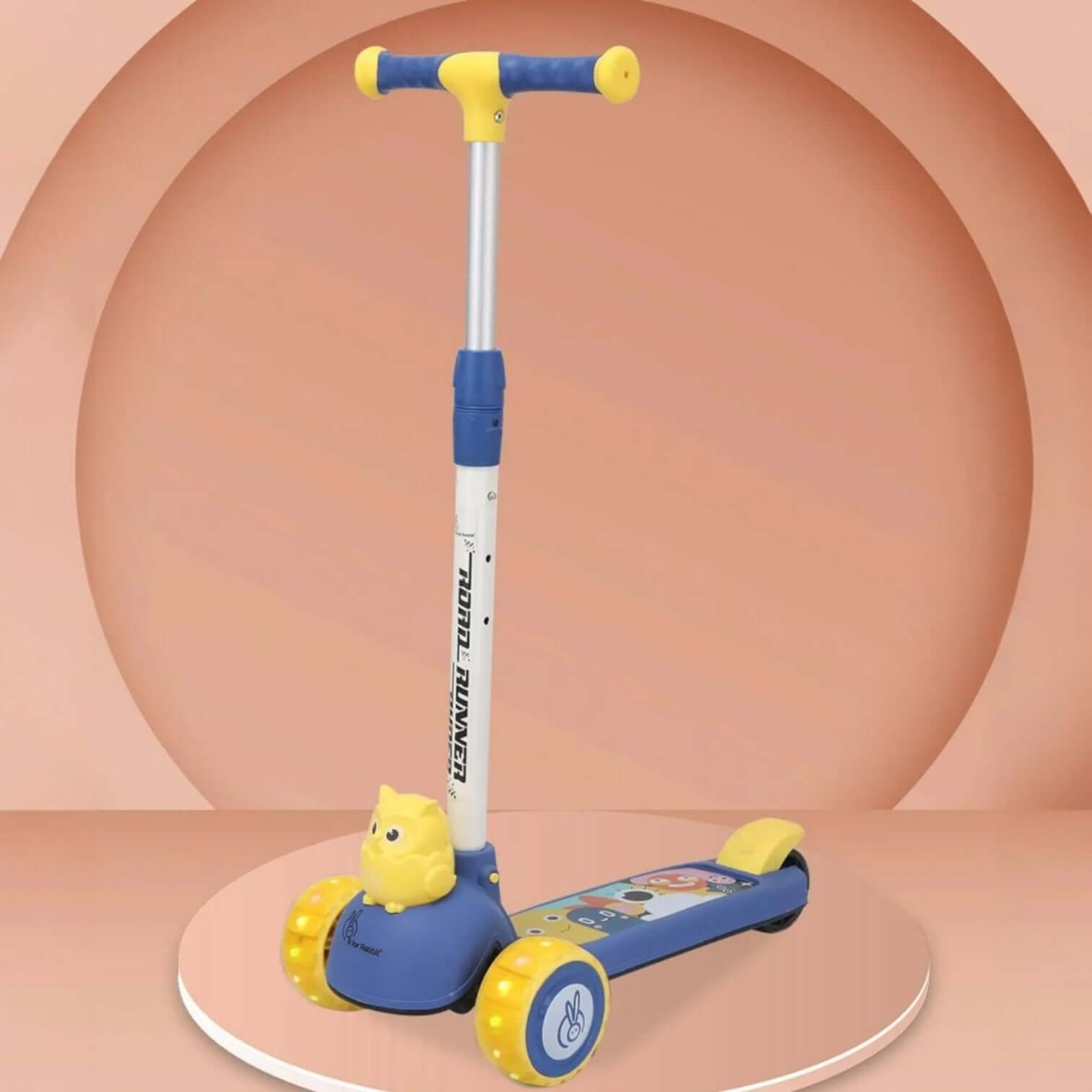 Children's scooter with blue and yellow accents on a peach-colored background