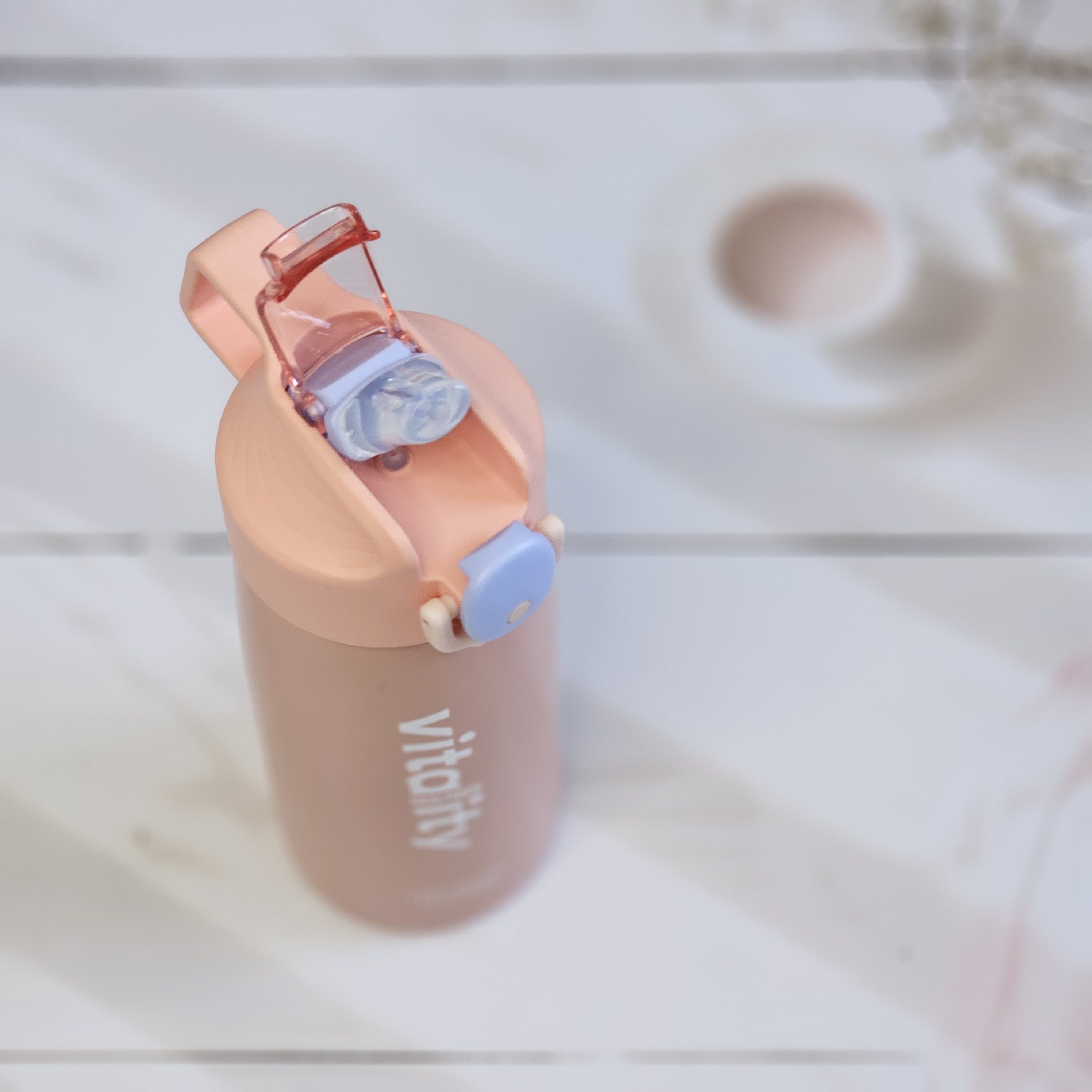 Stainless steel water bottles for kids and adults, featuring double-walled insulation, flip-top lids, and 'keep moving healthier' www.usmile.toys