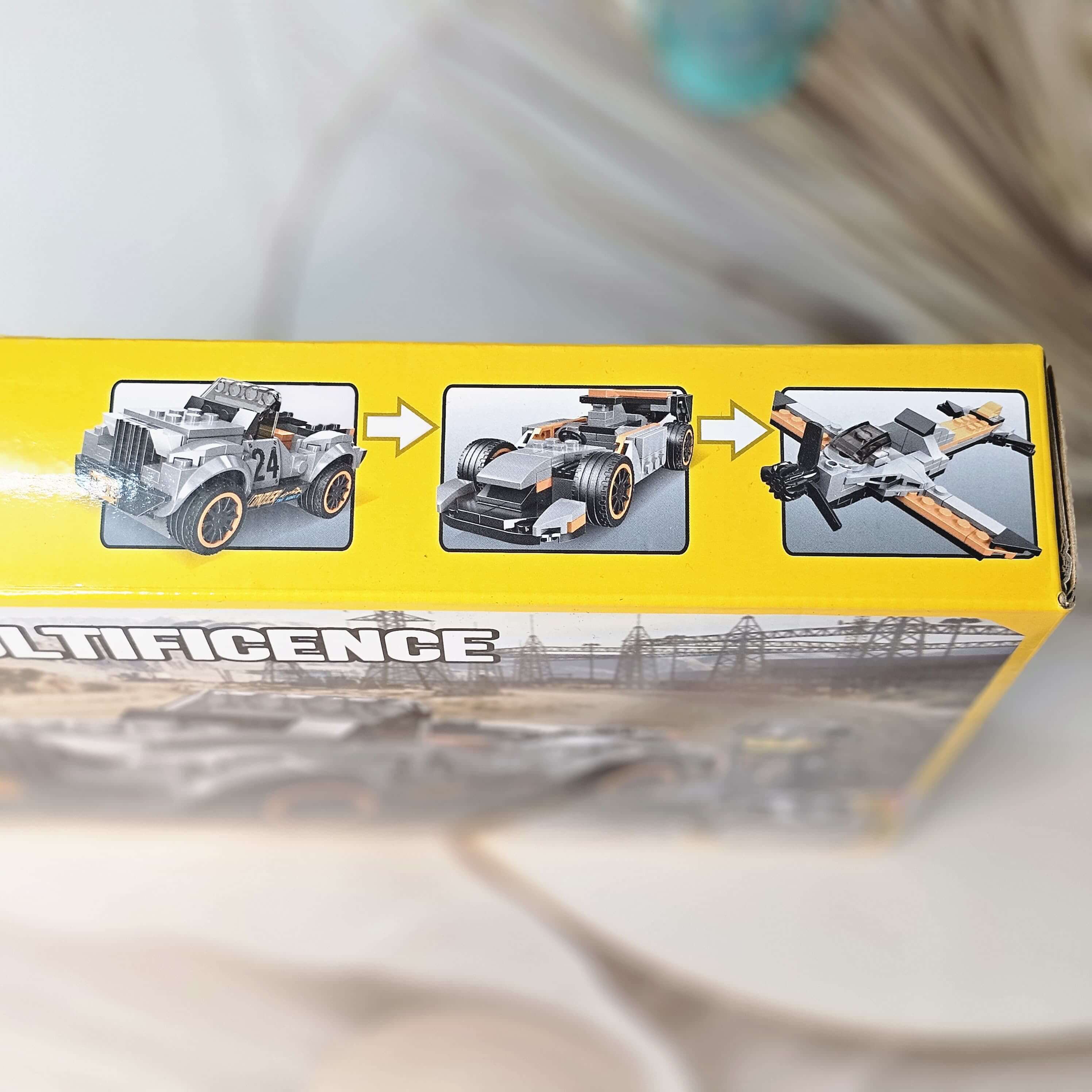 Front of the product packaging for a building block toy set, showing a constructed gray jeep-like vehicle and a character figure against a desert road background, promoting imaginative play from Usmile Toys.www.usmile.toys