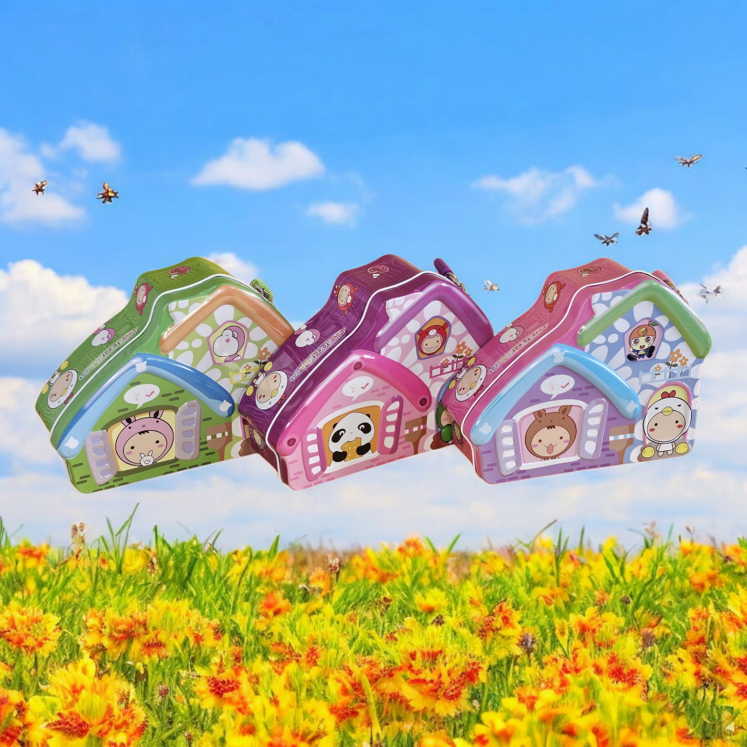 Three colorful house-shaped metal money boxes (piggy banks) for kids, featuring various cute animal and character designs on a background of a sunny field. Ideal for teaching saving from uSmile.toys. www.usmile.toys