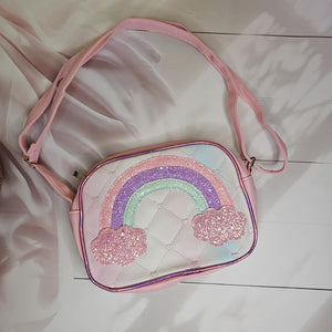 Stylish rainbow glitter sling bag with a single chain strap and shaded rainbow design, a trendy accessory for girls in www.usmile.toys
