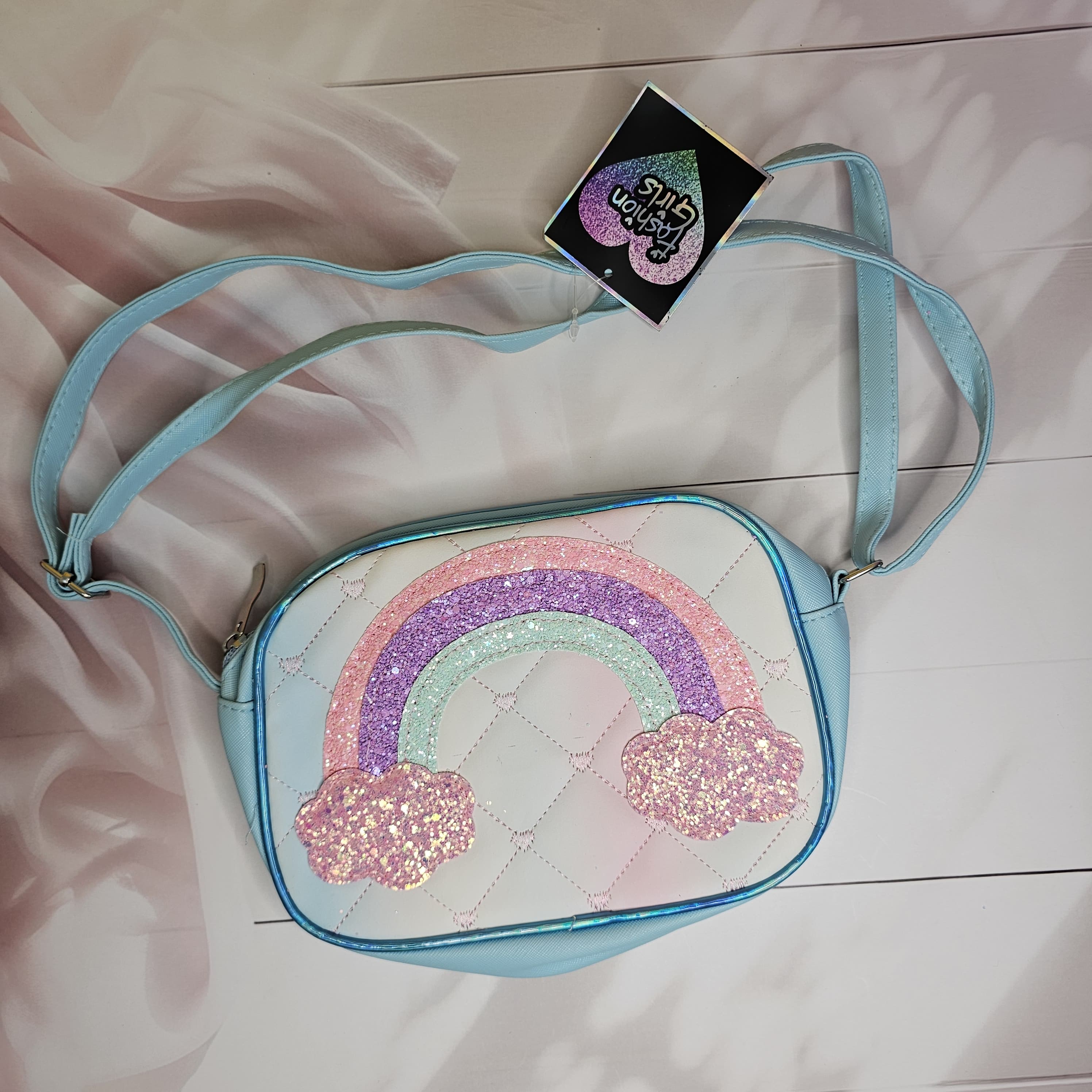Shimmering shaded rainbow sling bag featuring glitter clouds and a delicate single chain, a cute purse for young girls in www.usmile.toys