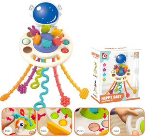 Happy Baby" silicone sensory Pull String Toy in a space theme, featuring an astronaut helmet, colorful pull cords, and press/push buttons for toddlers' fine motor skill development, with packaging. www.usmile.toys