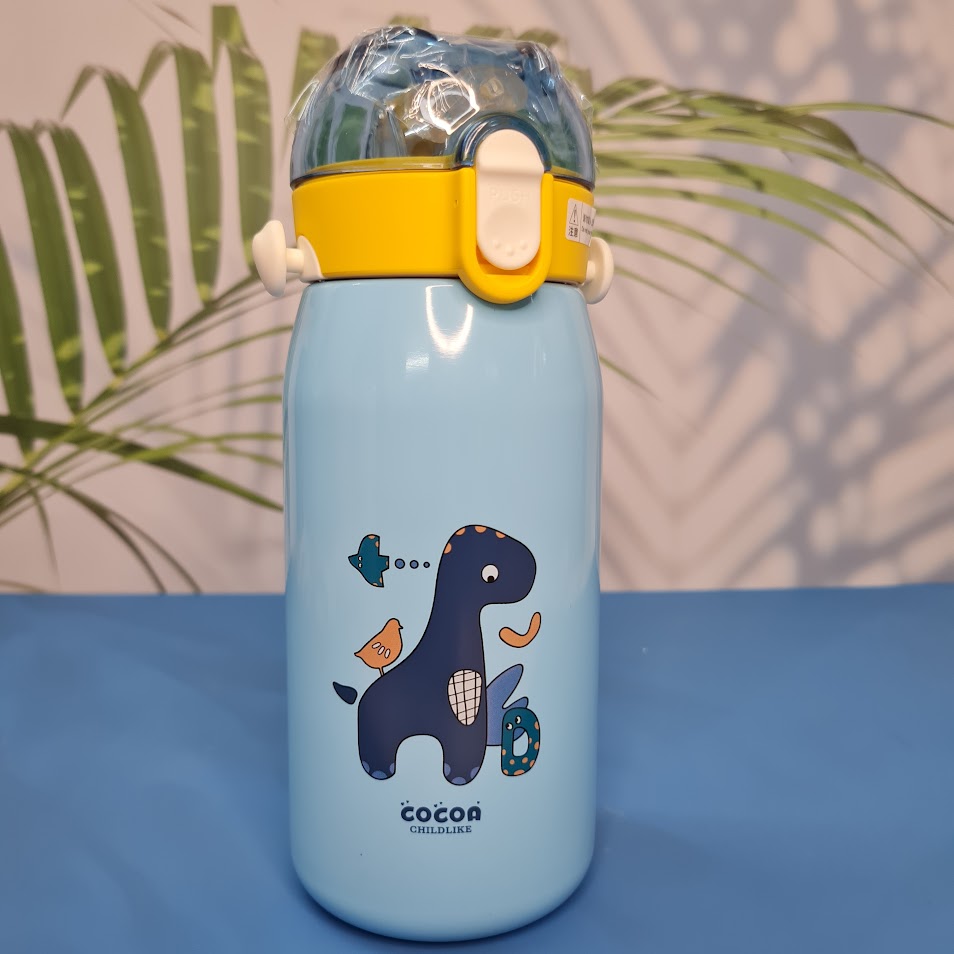 A set of four colorful, insulated stainless steel water bottles designed for children. Each bottle features a flip-top straw lid, cute cartoon animal illustrations (dinosaur, hedgehog, bear chef, elephant with 'E'), the "Cocoa" brand name, and a detachable "LOVELY" patterned shoulder strap. Ideal for keeping drinks cold or warm on the go