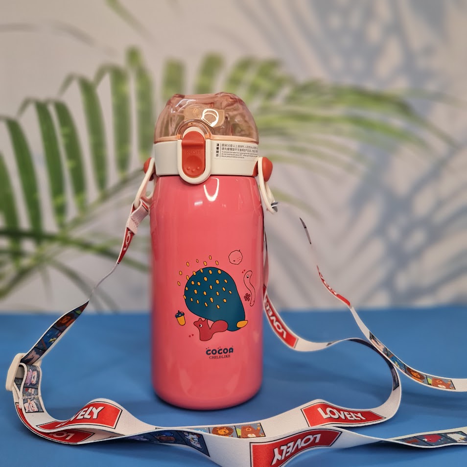 A set of four colorful, insulated stainless steel water bottles designed for children. Each bottle features a flip-top straw lid, cute cartoon animal illustrations (dinosaur, hedgehog, bear chef, elephant with 'E'), the "Cocoa" brand name, and a detachable "LOVELY" patterned shoulder strap. Ideal for keeping drinks cold or warm on the go
