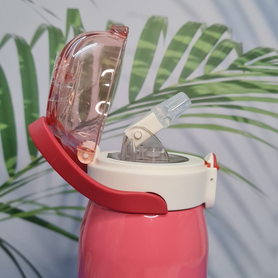 A set of four colorful, insulated stainless steel water bottles designed for children. Each bottle features a flip-top straw lid, cute cartoon animal illustrations (dinosaur, hedgehog, bear chef, elephant with 'E'), the "Cocoa" brand name, and a detachable "LOVELY" patterned shoulder strap. Ideal for keeping drinks cold or warm on the go