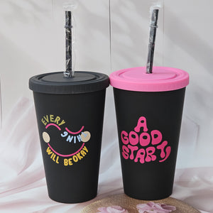 Return gift: Two trendy black sipper cups with straws, one with a yellow "EVERYTHING WILL BE OKAY" quote and smiley face, the other with a pink "A GOOD START" quote and pink lid, from www.usmile.toys