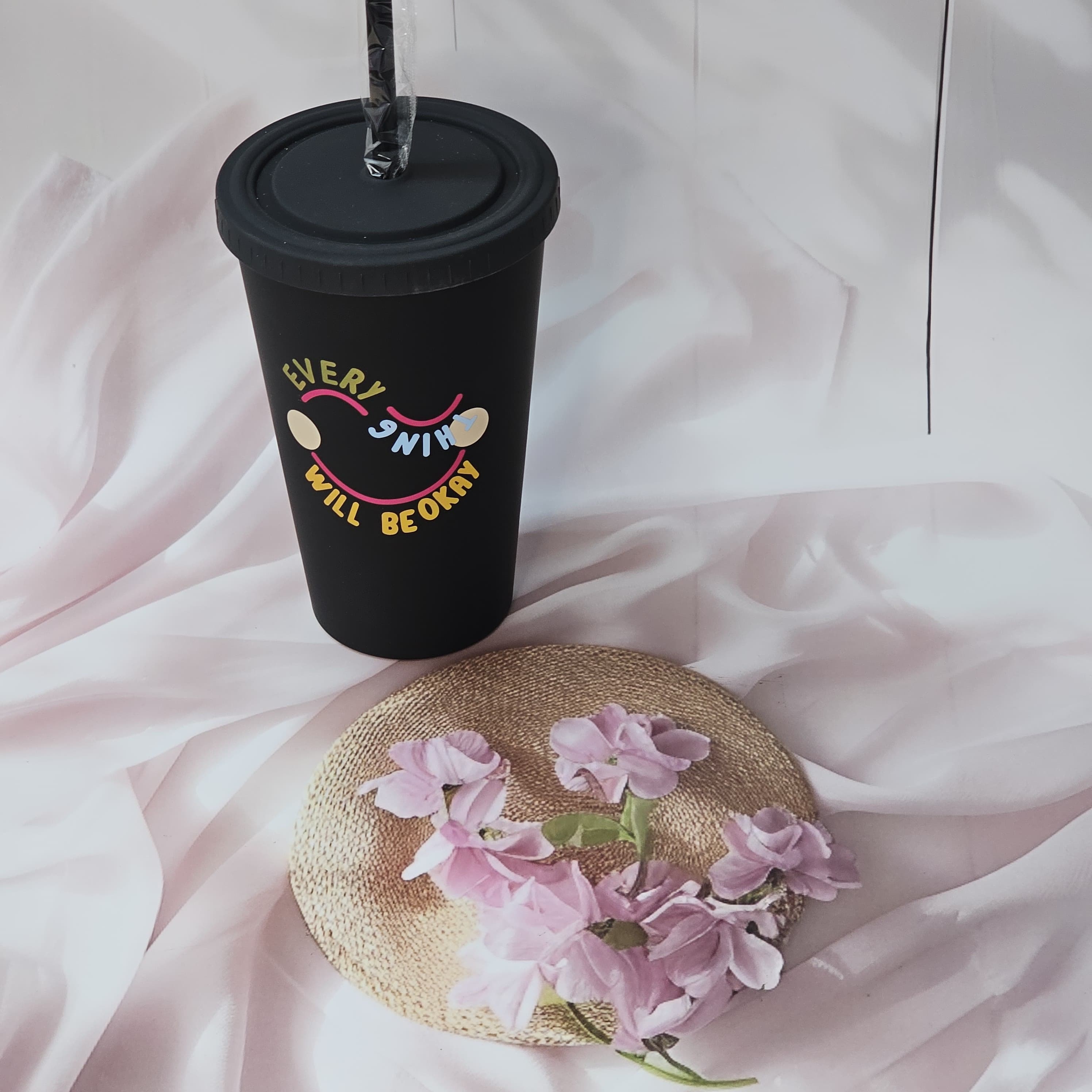 Trendy black sipper cups with "EVERYTHING WILL BE OKAY" and "A GOOD START" quotes, colored lids and straws, perfect for return gifts from www.usmile.toys